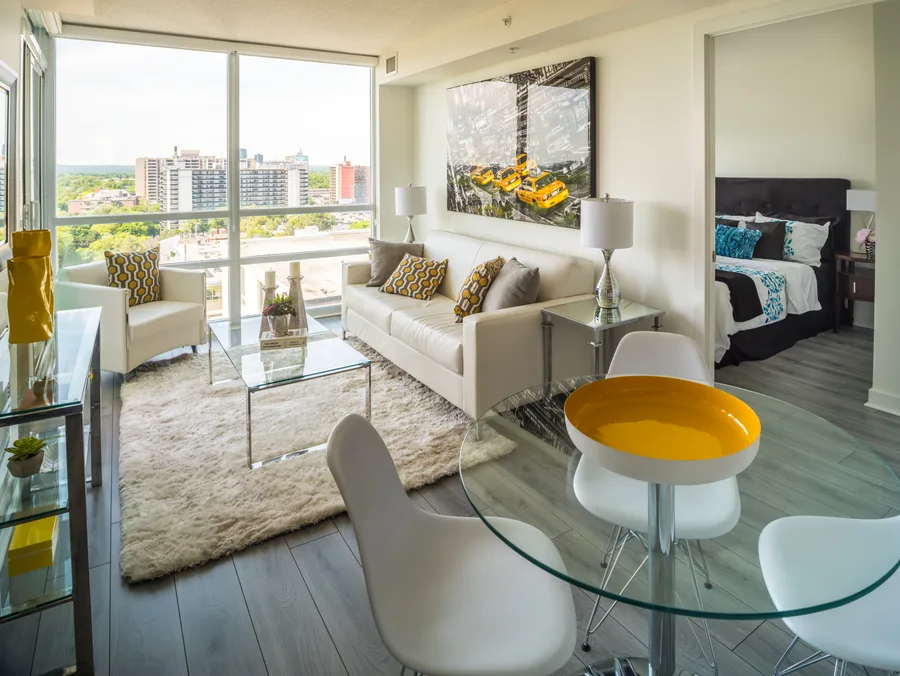 Bright condo living room with a view of the Toronto skyline