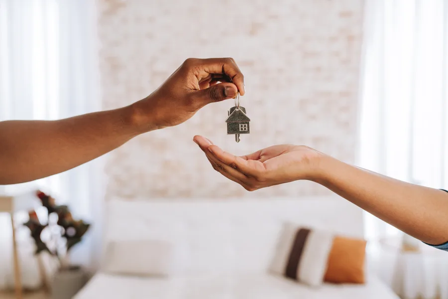 House keys being handed to a new owner